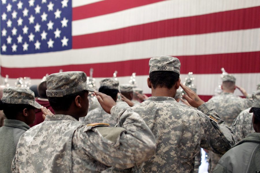 Soldiers+salute+the+U.S.+flag+during+a+recitation+of+the+Pledge+of+Allegiance+at+a+welcome+home+ceremony+for+soldiers+returning+from+a+deployment+in+Afghanistan%2C+at+Fort.+Carson%2C+Colo.%2C+Wednesday+Dec.+5%2C+2012.+Nearly+300+soldiers+of+the+4th+Brigade+Combat+Team%2C+4th+Infantry+Division%2C+returned+home+after+a+tour+of+duty+that+began+in+February.+%28AP+Photo%2FBrennan+Linsley%29